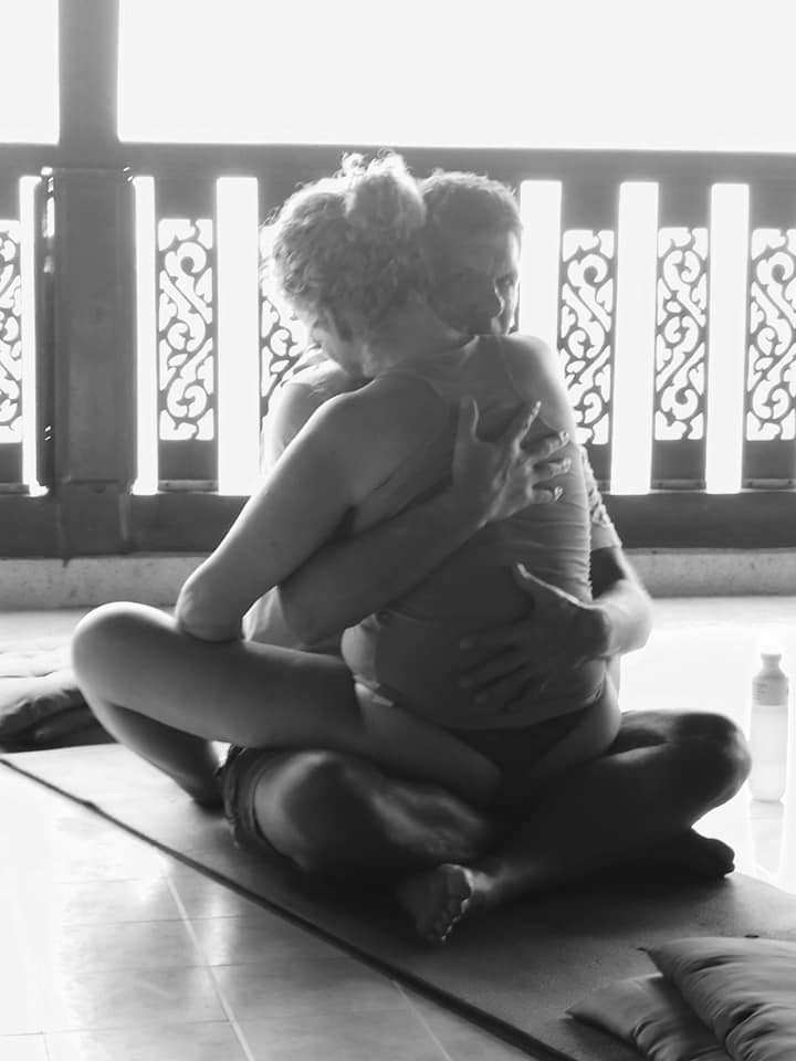 Tantric Couple sitting in tantra pose at a couples retreat